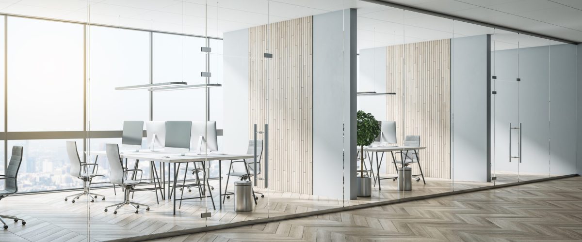 Glass-partition-walls-create-multiple-meeting-rooms-in-modern-office-space-scaled